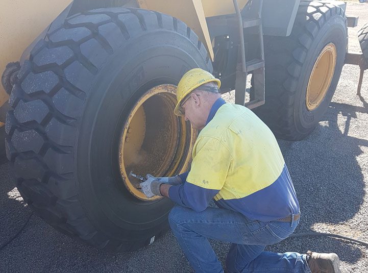 Technician Working on Kawasaki Loader — Goodyear Auto Care In Toowoomba, QLD