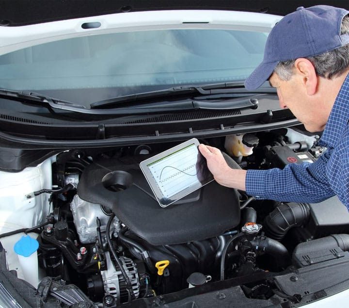 Car Mechanic With Diagnostic Tool — Goodyear Auto Care In Toowoomba, QLD